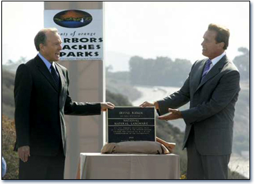 Gov. Arnold Schwarzenegger congratulates Irvine Company Chairman Donald Bren after he received a plaque in recognition of 37,000 acres of the Irvine Ranch being recognized as a National Natural Landmark.