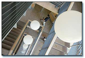 DEDICATION: Above, balloons fill the stairwell as guests tour the new Donald Bren Hall at UC Irvine on Wednesday. Below, Bren during the ceremony.