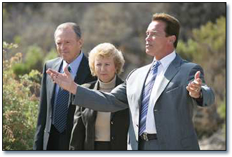 From left: Irvine Company Chairman Donald Bren; National Park Service Director Fran Mainella, and Gov. Arnold Schwarzenegger walk through Crystal Cove State Park.